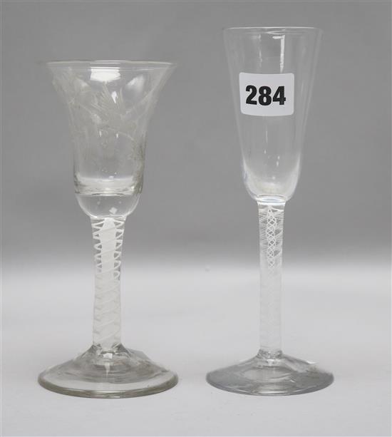 Two 18th century wine glasses with opaque twist stems, one etched with a bird and vines 14.5cm